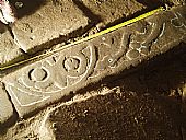 chalk marks patterns on carved stone